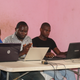 Workers at tech startups in New Bonako village which has been affected by the internet shutdowns over the last year.